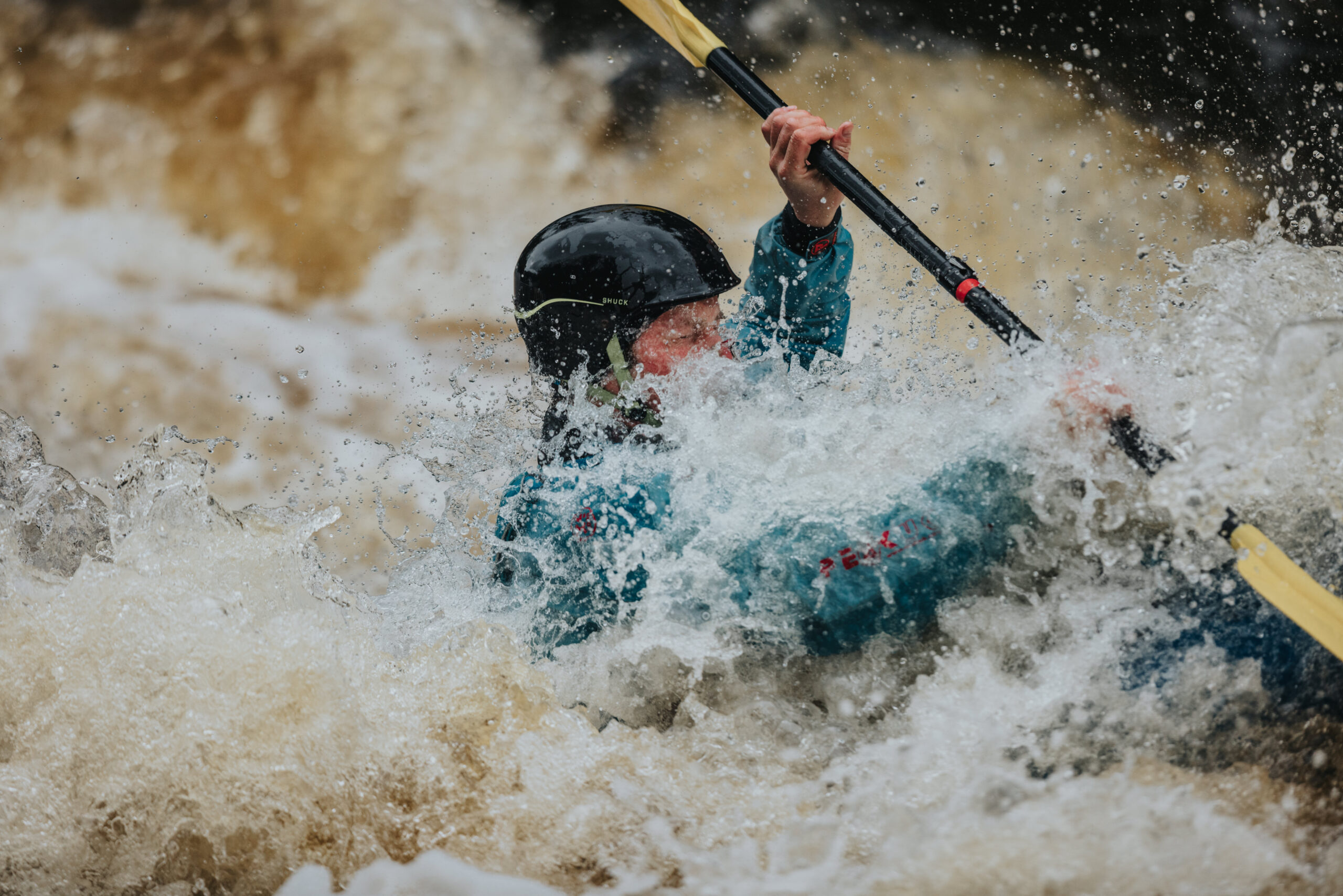 Kayaker in River rapids